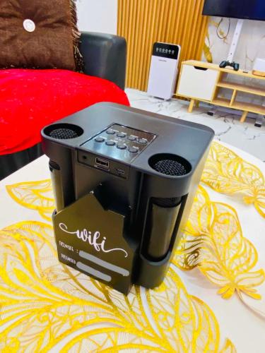 a stove sitting on top of a table at Phoenix Bliss - Amber in General Trias