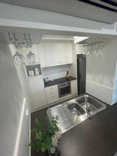 a kitchen with a sink and a counter top at Unit in Stuart in Alice Springs