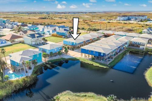 an aerial view of a resort with a arrow pointing to a house at No Regrets PET FRIENDLY in Port Aransas