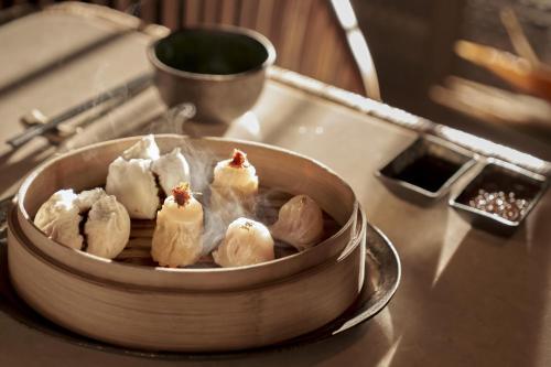 a bowl of dumplings sitting on a counter at Regent Phu Quoc in Phu Quoc