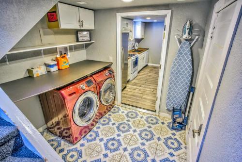 a small kitchen with a washing machine in a room at Olympic House Downtown w Hot Tub Fire pit & BBQ in Colorado Springs