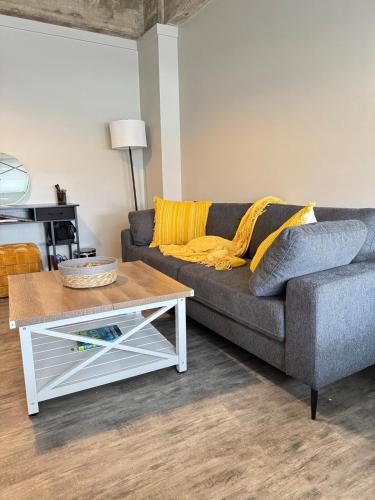 a living room with a couch and a coffee table at Horizon Hideaway in Mobile