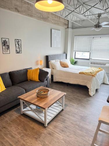 a living room with a couch and a bed at Horizon Hideaway in Mobile