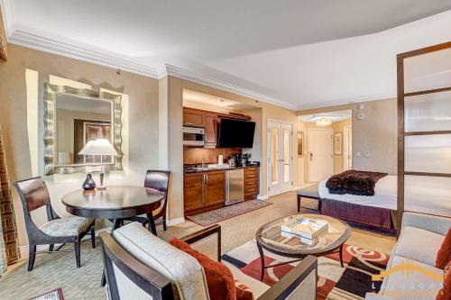 a hotel room with a bed and a living room at MGM Signature-22-615 Strip View Balcony Studio in Las Vegas