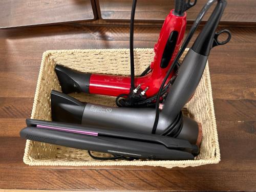 a basket with a red and black item in it at Hong Principal House in Daegu
