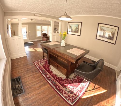 a dining room with a table and a chair at Private Room in an Elegant Home- Convenient to Downtown Indianapolis in Indianapolis