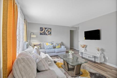 a living room with a couch and a table at Luxury 1 bedroom apartment in Cincinnati in Cincinnati