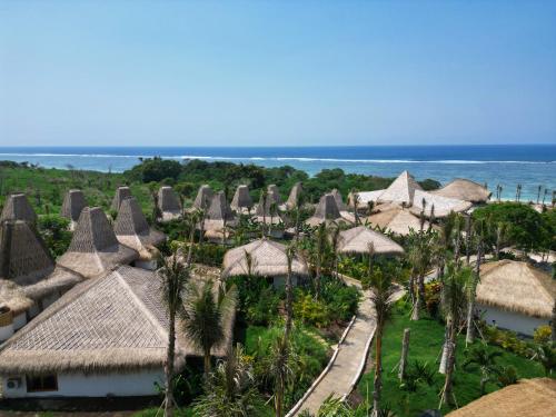 an aerial view of the resort with the ocean in the background at ARYA Sumba Resort - Kodi in Tambolaka