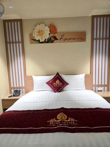 Ένα ή περισσότερα κρεβάτια σε δωμάτιο στο Rosy Hotel 6