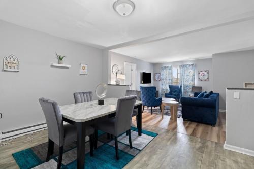 a dining room and living room with a table and chairs at Luxury 2 bedroom apartment in Cincinnati in Cincinnati