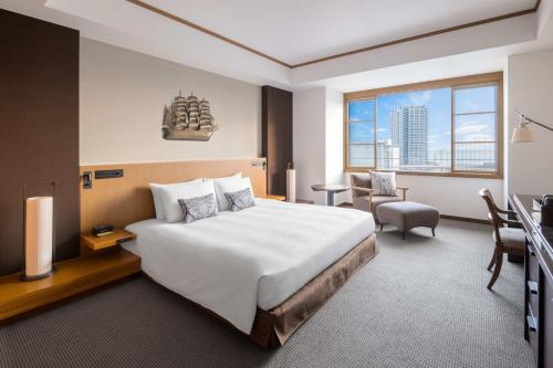 Postel nebo postele na pokoji v ubytování ORIENTAL HOTEL
