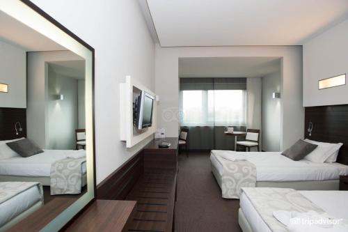Postel nebo postele na pokoji v ubytování Hotel Selene Pomezia