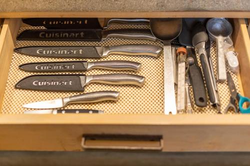 a drawer full of utensils in a wooden box at Ocean and Mountain Views home in El Pescadero in El Pescadero