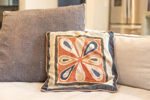 a pillow sitting on the back of a couch at Ocean and Mountain Views home in El Pescadero in El Pescadero