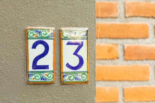 a house number on a brick wall at Ocean and Mountain Views home in El Pescadero in El Pescadero