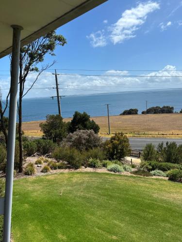 a view of the ocean from the porch of a house at Unit 135 Silverwater Resort San Remo Victoria in San Remo