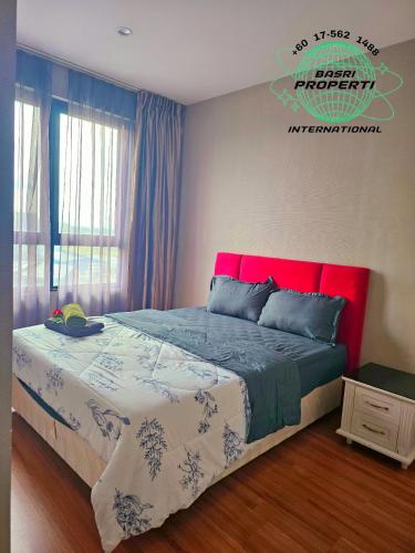 a bedroom with a large bed with a red headboard at I-City Hyde 2RooM 2TandaS BASRi PROPERTi in Shah Alam