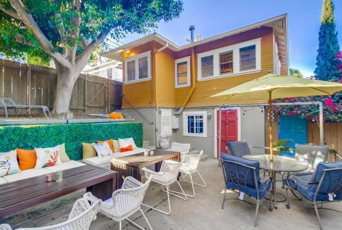 a patio with a table and chairs and a house at Sunny Golden Hill Studio! Fully Stocked - near DT in San Diego