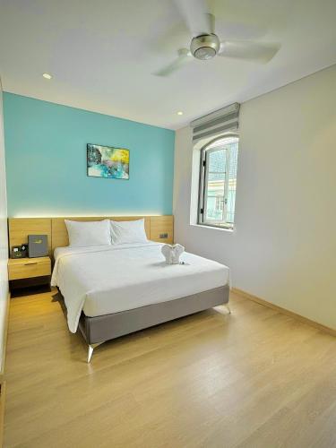 Postel nebo postele na pokoji v ubytování Laputa Hotel Phu Quoc