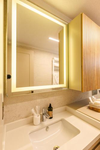 a bathroom with a sink and a mirror at Los Suites in Antalya