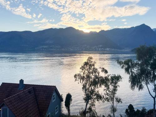 a view of a large body of water with a house at 6 person holiday home in Leikanger in Leikanger