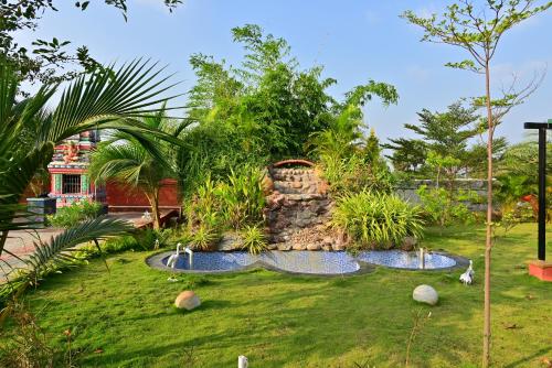 a garden with two fountains in a yard at AS Garden Villa in Ranipet