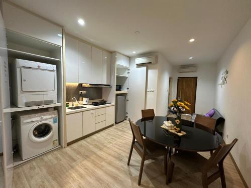 a kitchen and dining room with a table and a dining roomiasm at Joyful Seaview Studio 118 Island88 for 3pax in George Town