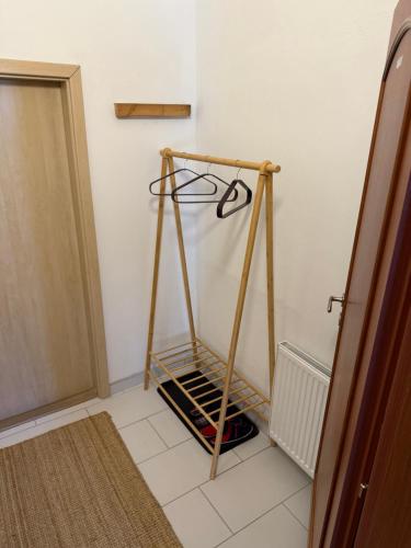 a room with a wooden stand in the corner at Apartmány v pivovaru in Kašperské Hory