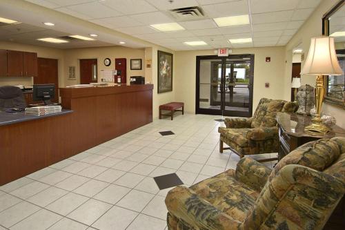 a waiting room with couches and a lobby with a hospital at Ramada Limited - Mount Sterling in Mount Sterling