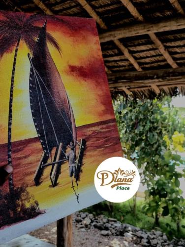 a sign with a picture of a boat on a beach at Diana Place in Paje