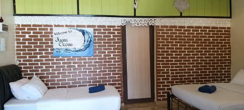 Ένα ή περισσότερα κρεβάτια σε δωμάτιο στο Juara Ocean Chalet