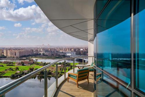 a balcony with a view of the city at Hilton Cairo Nile Maadi in Cairo