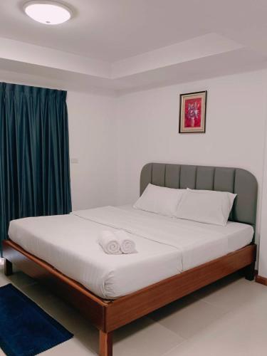 Postel nebo postele na pokoji v ubytování Convenient Resort