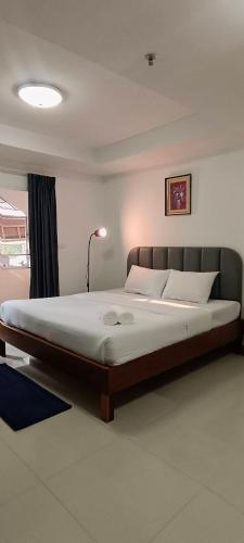 Postel nebo postele na pokoji v ubytování Convenient Resort