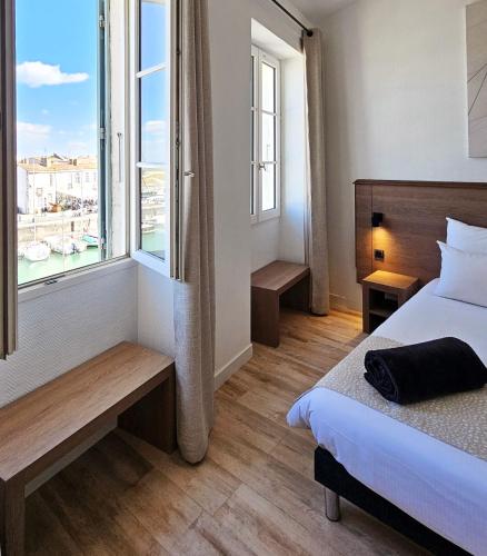 Letto o letti in una camera di Hôtel du Port