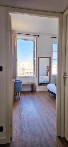Letto o letti in una camera di Hôtel du Port