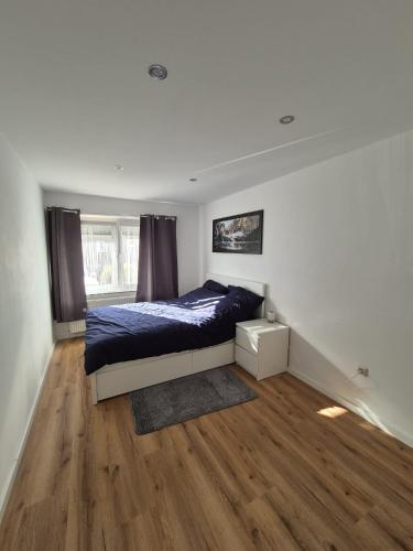 a bedroom with a bed and a window at Kezara Living in Konz