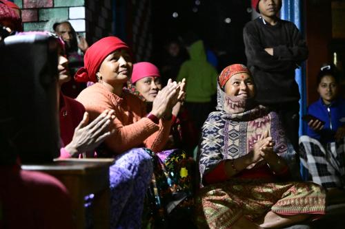 a group of people sitting in a room at Barang Village Community Homestay in Pokhara