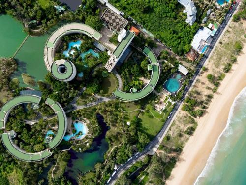 an aerial view of a resort with a beach at Pullman Phuket Karon Beach Resort in Karon Beach