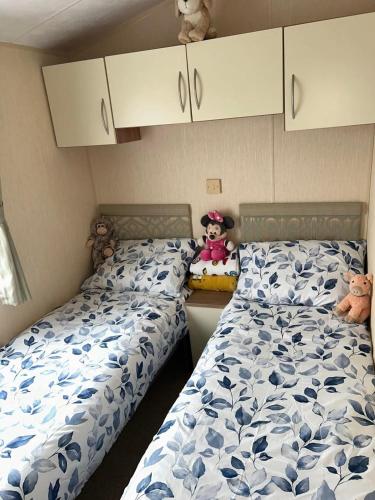 Ένα ή περισσότερα κρεβάτια σε δωμάτιο στο Metcalfes family caravan