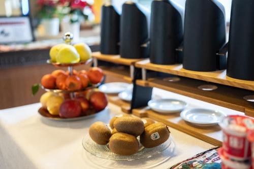 a table with plates of food on top at Foresteria Valdese Venezia in Venice