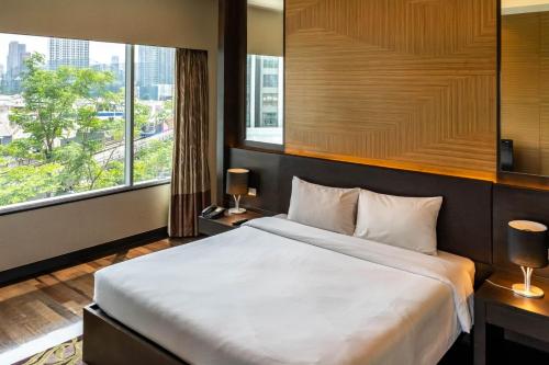 Postel nebo postele na pokoji v ubytování Jasmine Resort Bangkok