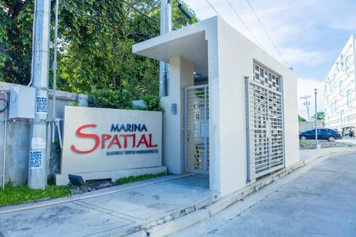 a building with a sign on the side of a street at Unit 26 SeaView Studio in Dumaguete