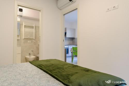 Ένα ή περισσότερα κρεβάτια σε δωμάτιο στο Condominio Gavioli - InVacanza