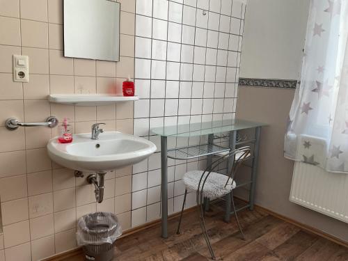 a bathroom with a sink and a mirror at Pension&Hostel Anna - Monteurzimmer -------- 10 minutes walk to Oktoberfest in Munich
