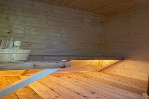a room with a wooden floor in a sauna at Comfortable holiday home with sauna and whirlpool in Lubin