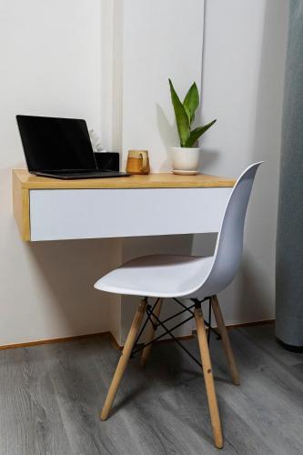 a desk with a laptop computer on top of it at Premium 2BR Apartment in Kathmandu near Thamel 3 in Kathmandu