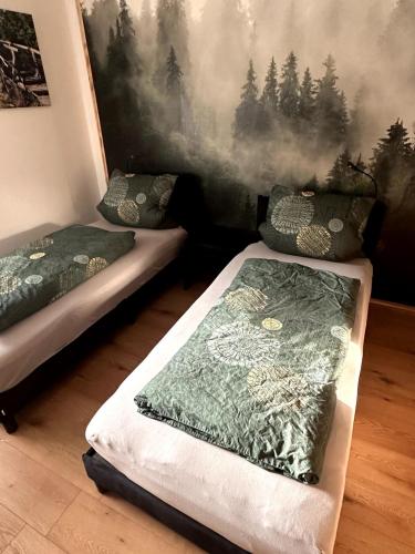 Postel nebo postele na pokoji v ubytování Haus am Widder in Baiersbronn-Obertal