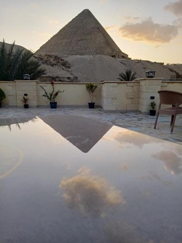 a view of the pyramids from a patio at Crystal pyramid inn in Cairo