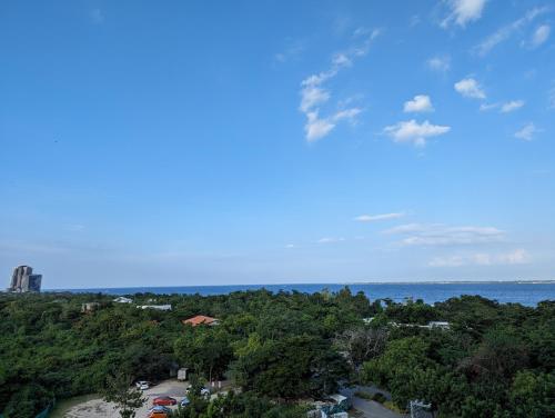 a view of the ocean and a city at Dominiks Comfort and silent Studio Tambuli Balcony Pool Mactan Ocean View High Floor in Lapu Lapu City